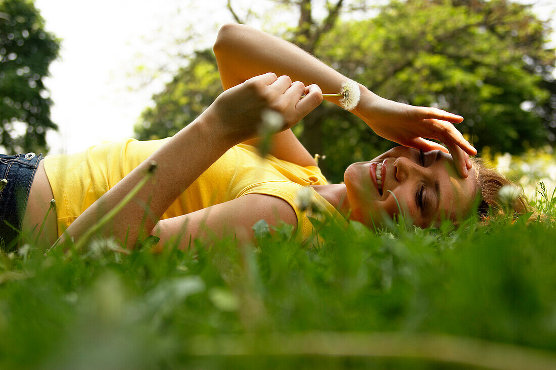 Young Woman Lying in Grass
