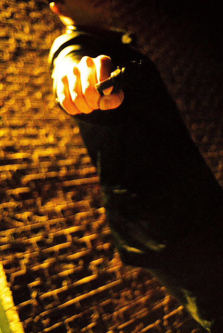 Man Pointing Gun in Dark