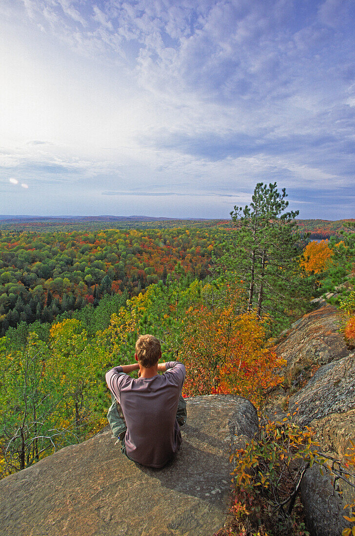 Hiker Sitting at Lookout Trail, Algonquin Park, Ontario