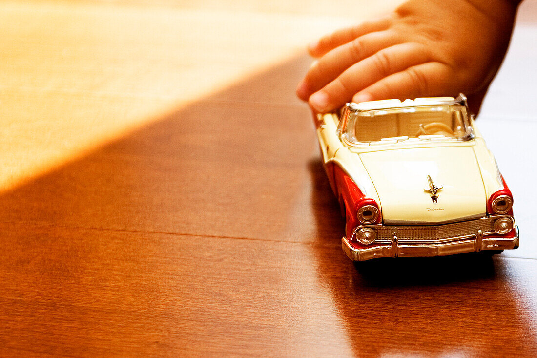 Detail of Child Holding Toy Car