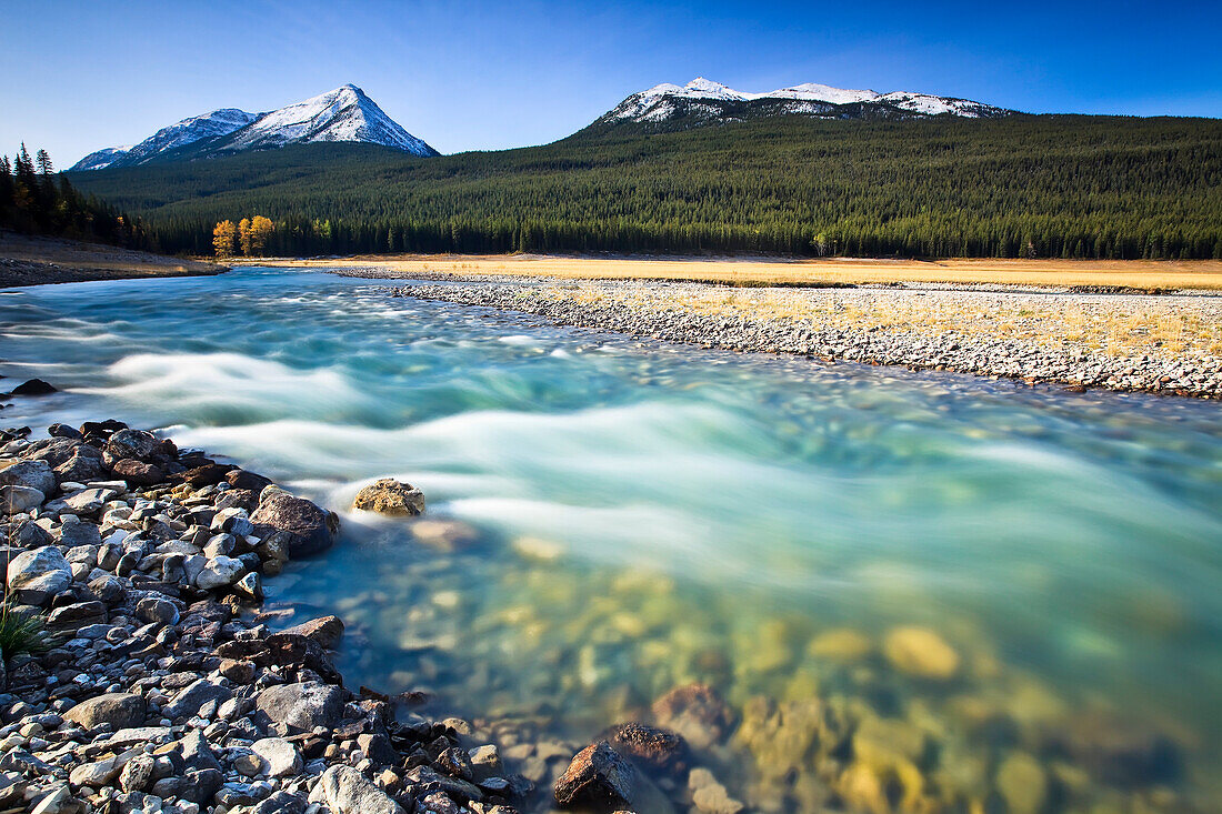 Medicine Lake and fast flowing waters from Maligne River, Jasper National Park, Alberta