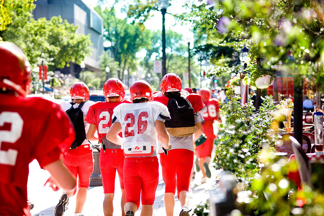 Football Players Running on Street, Grande-Allee, Quebec City, Quebec