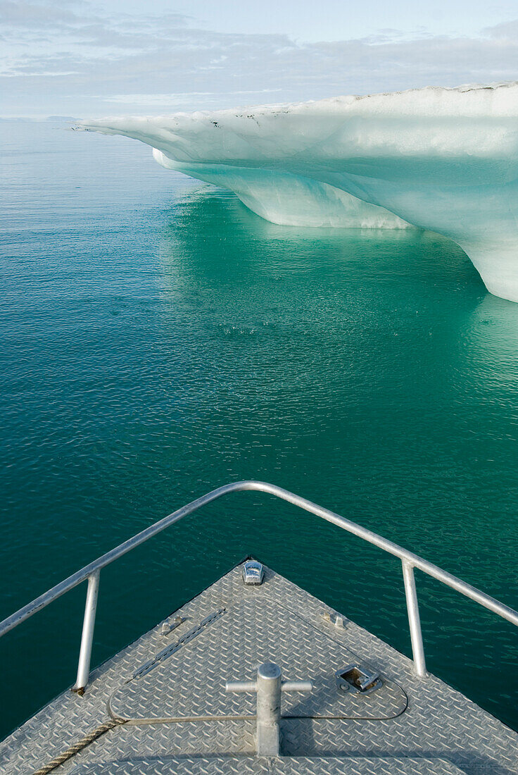 Boat and iceberg, Eclipse Sound, near Pond Inlet, Nunavut, Canada