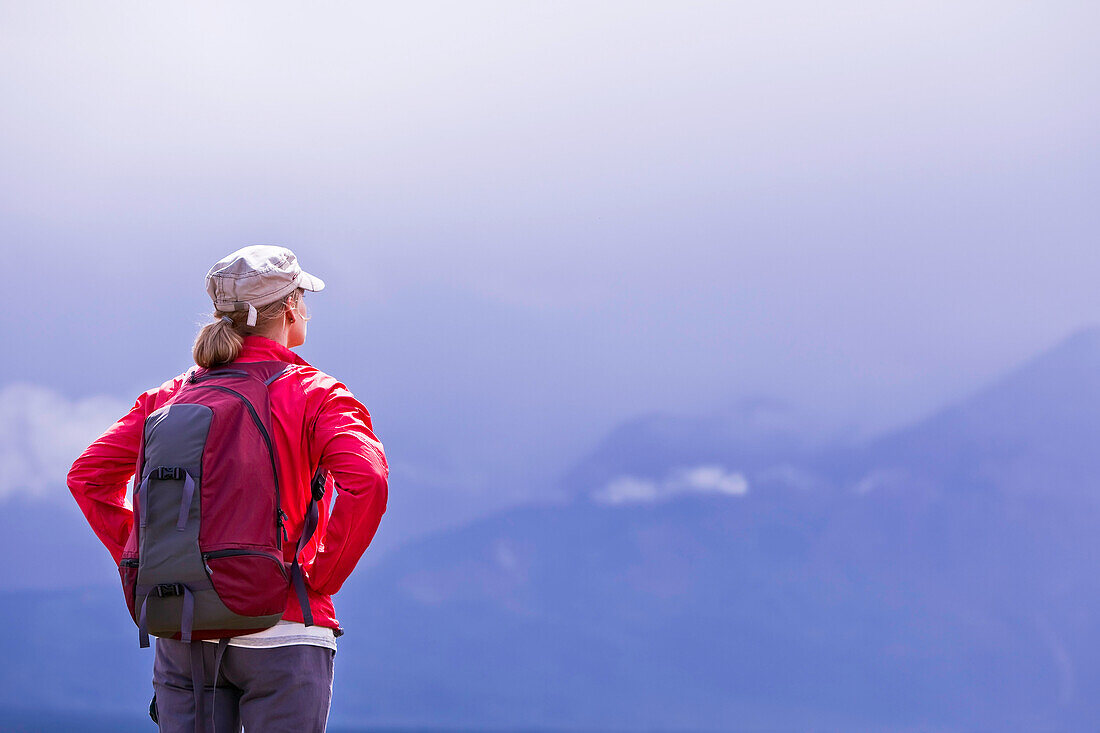 Hiker looking out over Waterton Lakes National Park, Alberta