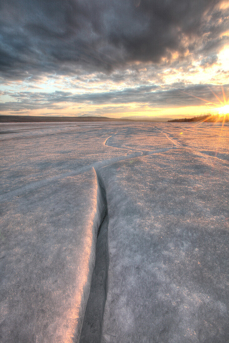 Setting sun on the ice of Teslin Lake, Yukon