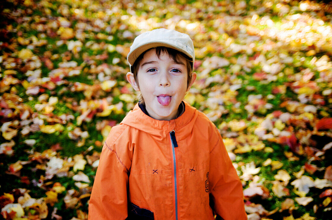 Boy sticking out his tongue, Maricourt, Quebec