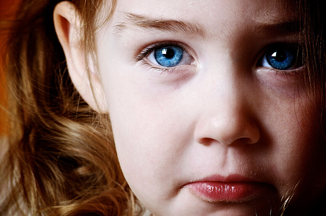 Close up of young girl with blue eyes, Otterburn, Quebec