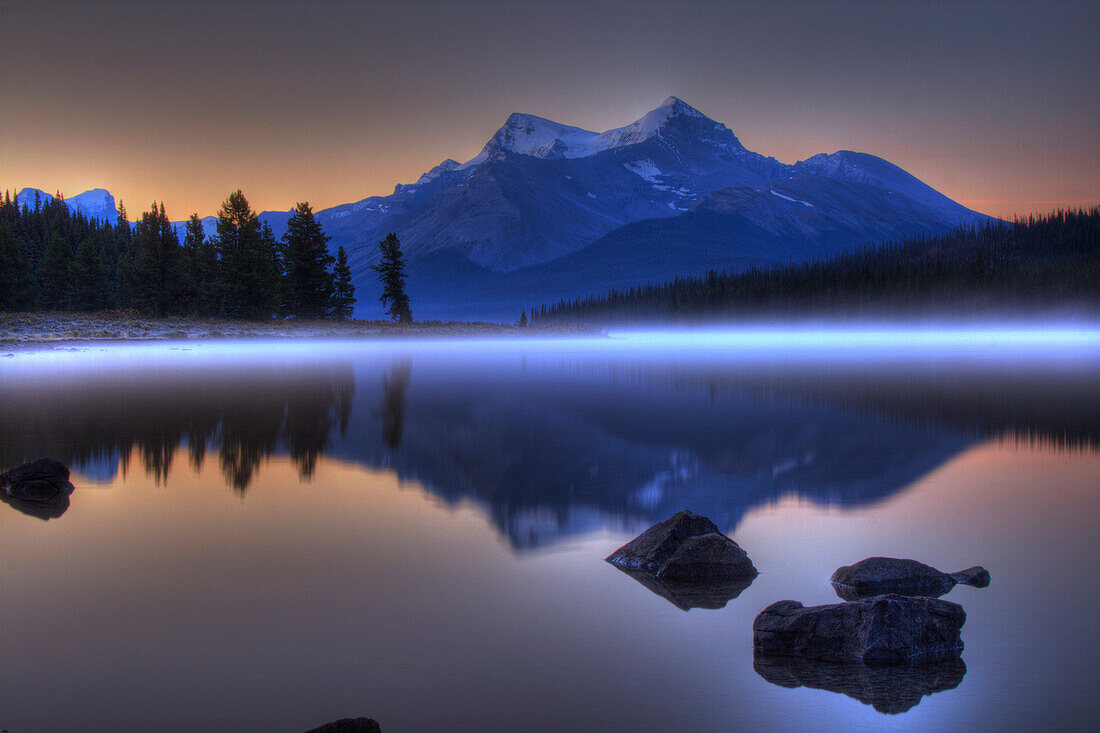 Sunrise on a Foggy Maligne Lake in Jasper National Park, Alberta