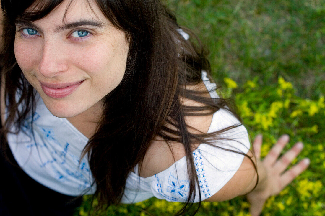 Young Woman Relaxing on Lawn, Toronto, Ontario