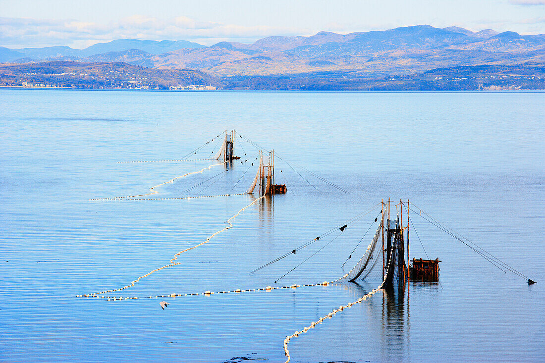 Eel Fishery in the St. Lawrence River with Mountains of Charlevoix Region in the background, Bas-Saint-Laurent Region, Saint-Denis, Quebec