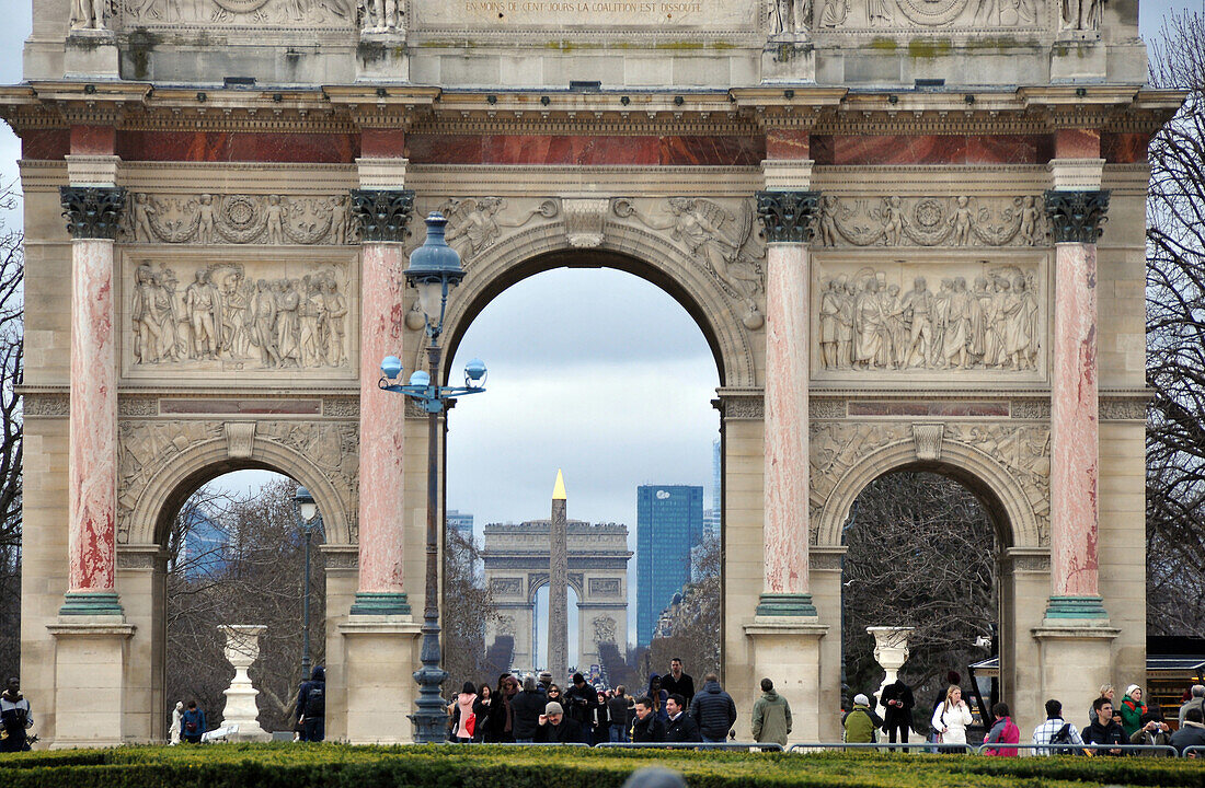 View through Arc de Triomphe du Carrousel towards Arc de Triomphe and La Defense, Paris, France