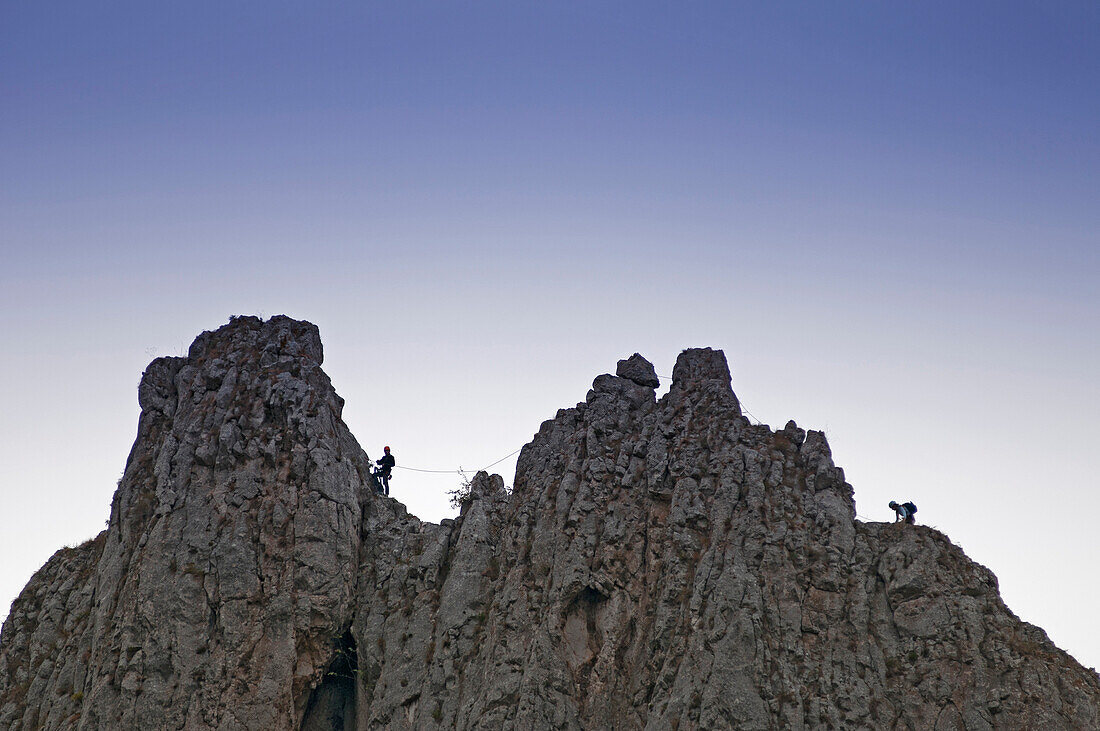 climbers on the limestone cliffs above Turda Gorge near the town of Turda, Transylvania, Romania