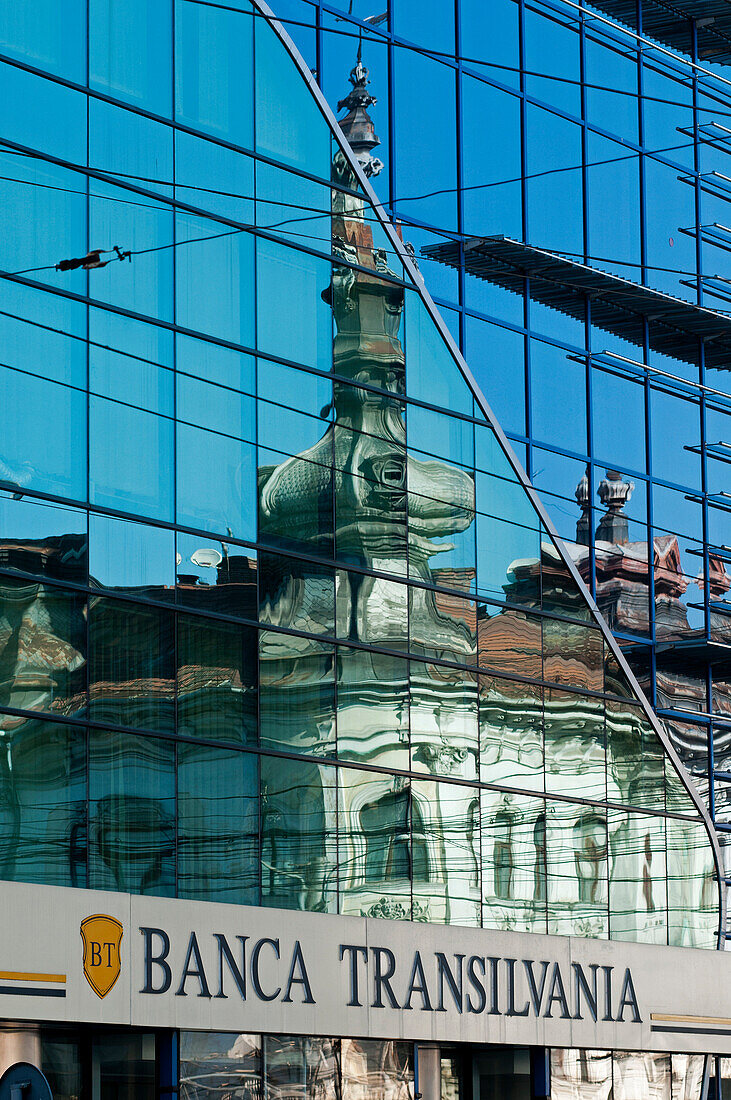 Reflections in a modern bank building, Cluj-Napoca, Transylvania, Romania