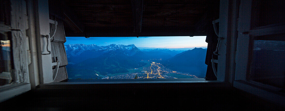 View out of a window of Wank mountain hut to Garmisch-Partenkirchen, Ester Mountains, Upper Bavaria, Bavaria, Germany