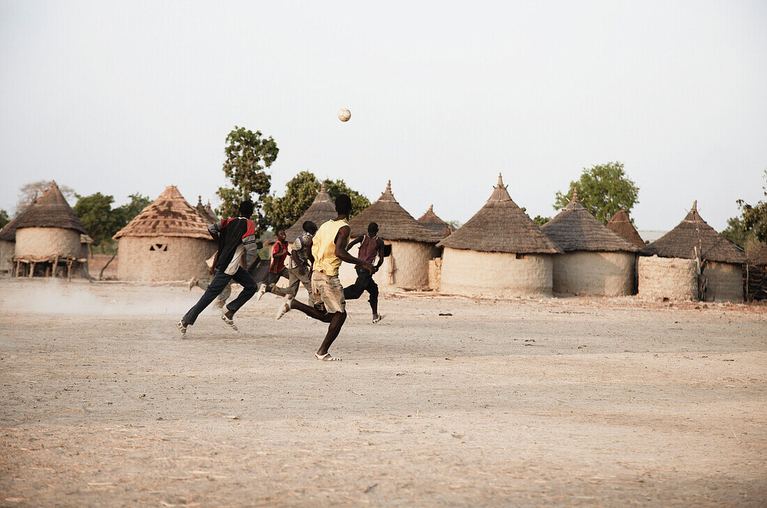 Boys playing soccer, Magadala, Mali