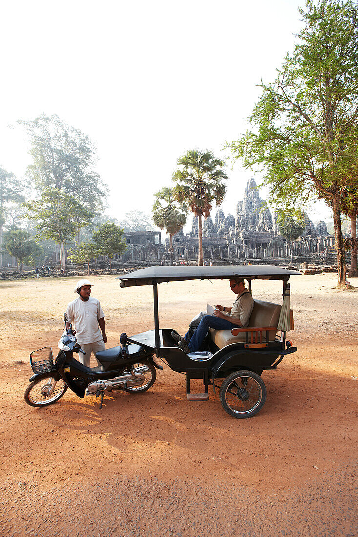 Tuk-tuk near Bayon Temple, Angkor Archaeological Park, Siem Reap, Cambodia