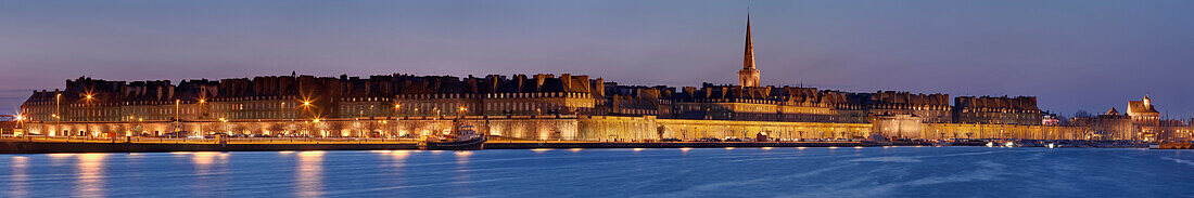 Panoramic view of old town with fortifications and the Cathedral at dusk, Saint-Malo, Ille-et-Vilaine, Brittany, France