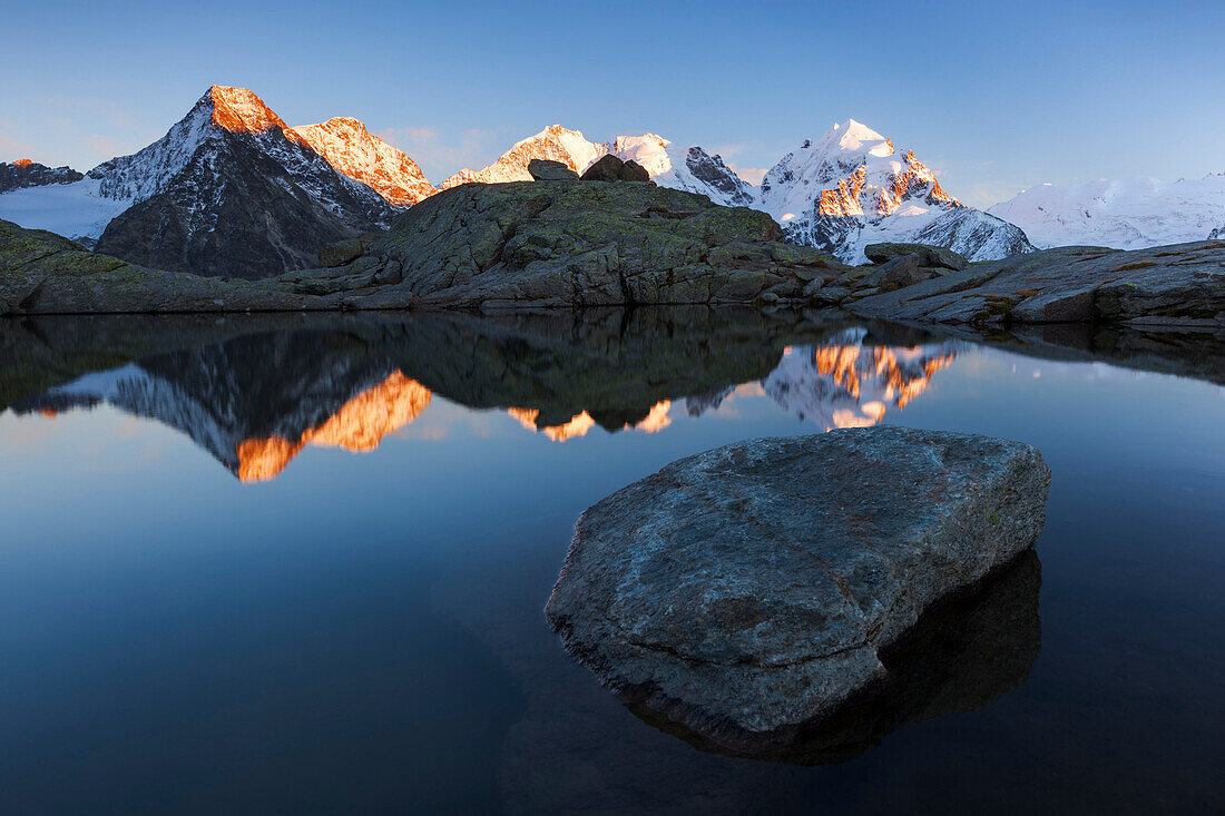 Alpenglow on the peaks of Bernina Range, Val Roseg, Engadin, Canton of Grisons, Switzerland