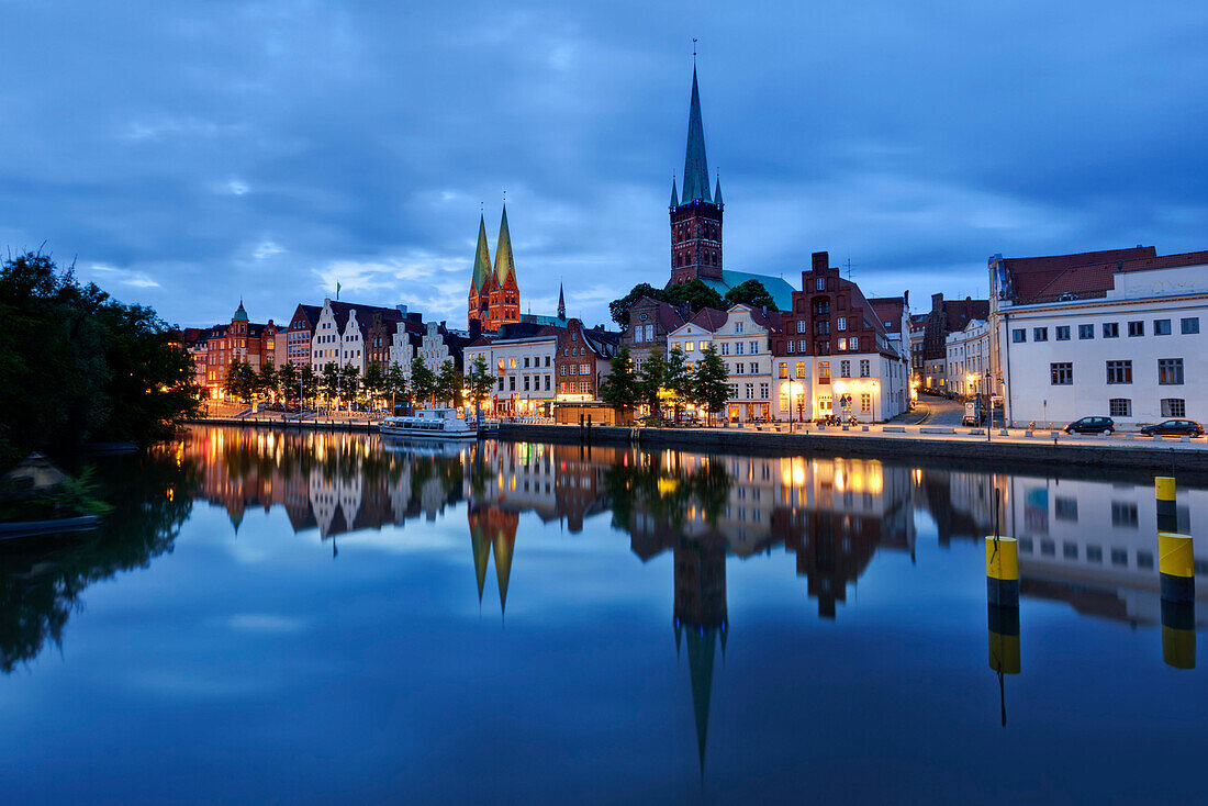 View over river Trave to old town with church St. Mary and church St. Peter in the evening, Lubeck, Schleswig-Holstein, Germany