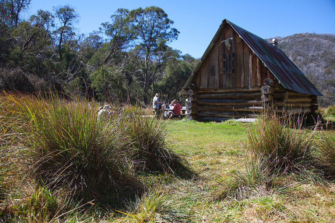 Hikers resting at Dibbin Hut, Alpine National Park, Victoria, Australia