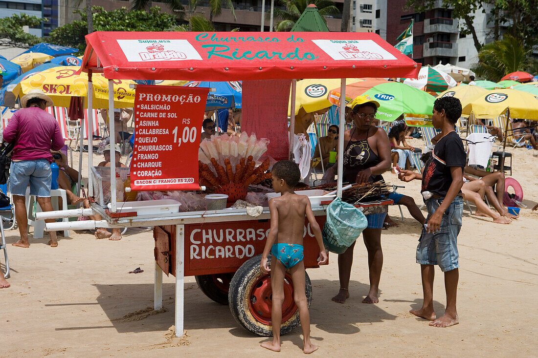 Grilling BBQ skewers at Churrasco do Ricardo beach cart, Recife, Pernambuco, Brazil, South America