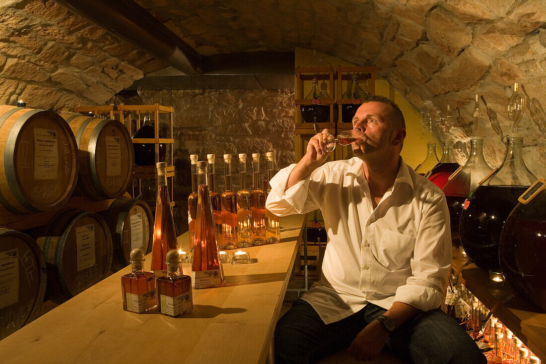 Proprietor Juergen H. Krenzer in the apple wine and sherry cellar at Rhoener Schau-Kelterei, Gasthof Zur Krone, Das Rhoenschaf-Hotel, Ehrenberg Seiferts, Rhoen, Hesse, Germany