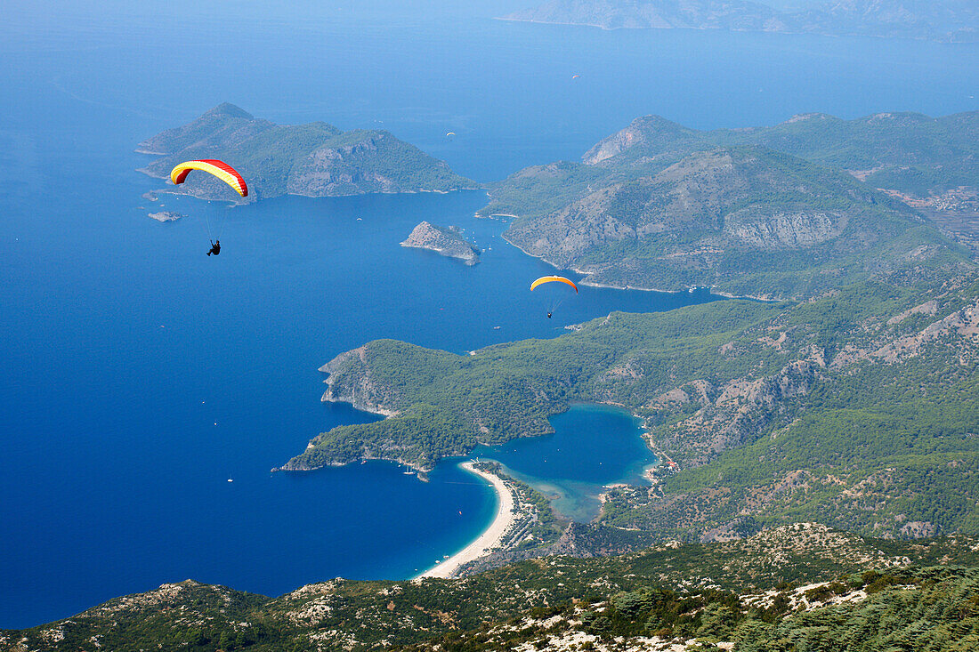 Paragliders At Mt Babadag (1950 Meters) To Oludeniz At The Turquoise Coast, Southern Turkey