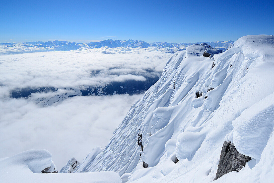 Snow covered south face of Birnhorn with sea of fog in the valleys, back-country skiing, Birnhorn, Leoganger Steinberge range, Salzburg, Austria