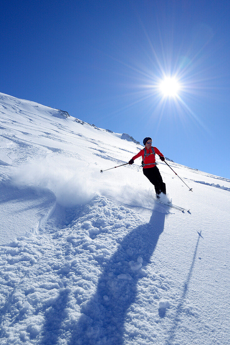 Woman downhill skiing, Birnhorn, Leoganger Steinberge, Salzburg, Austria