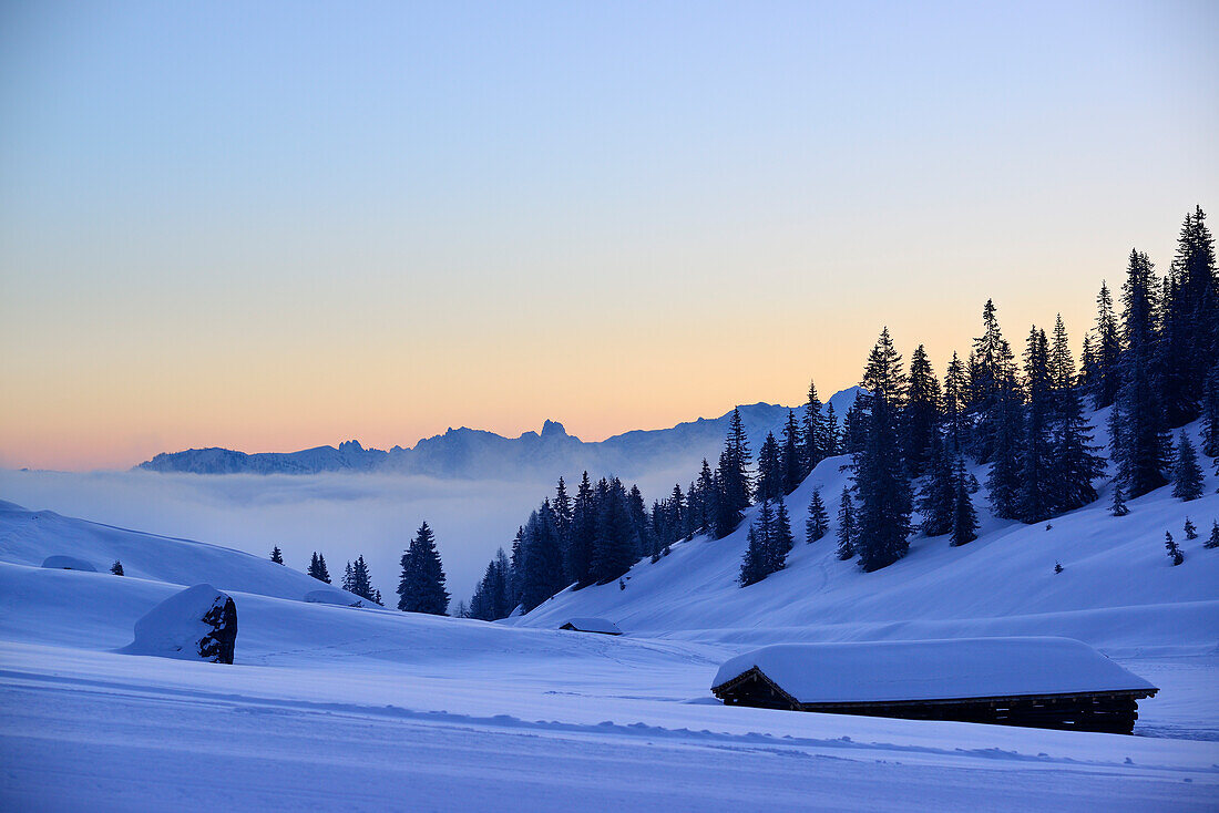 Snow-covered alpine huts with view to Dachstein range, Arthurhaus, Hochkoenig, Berchtesgaden range, Salzburg, Austria