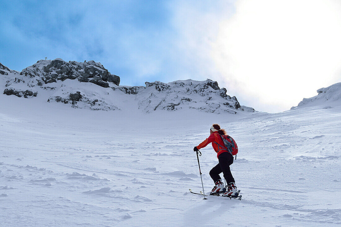 Female backcountry skier ascending to Hocheisspitze, Berchtesgaden Alps, Upper Bavaria, Bavaria, Germany