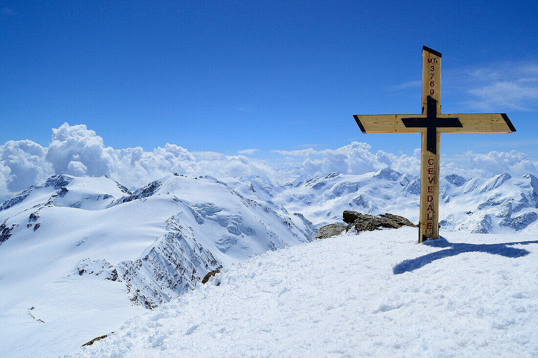 Summit of Cevedale with cross, view to Monte Vioz, Palon de la Mare and Punta San Matteo, Cevedale, Ortler range, South Tyrol, Italy