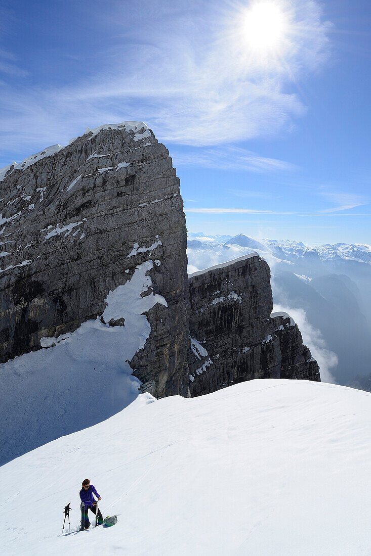 Woman back-country skiing ascending Fuenftes Watzmannkind, view to Viertes and Drittes Watzmannkind, Watzmannkar, Berchtesgaden range, National Park Berchtesgaden, Upper Bavaria, Bavaria, Germany