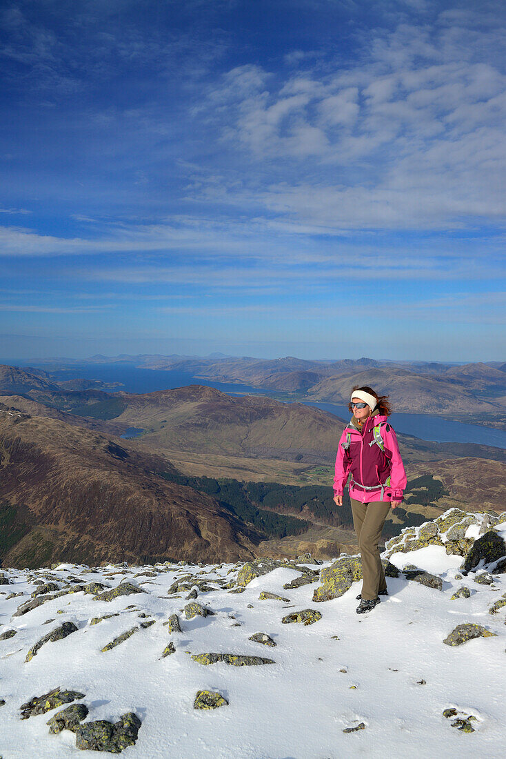 Female hiker ascending to Ben Nevis, Loch Linnhe in background, Highlands, Scotland, United Kingdom