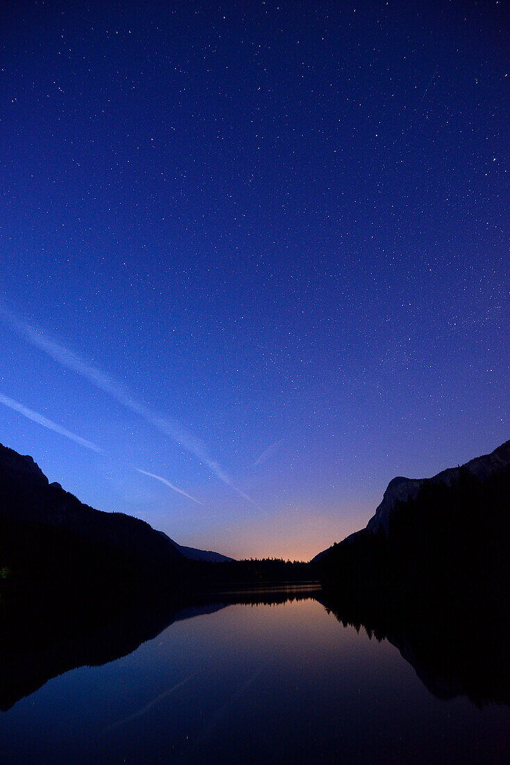 Night sky with stars above lake Tovel, lake Tovel, Brenta range, Brenta, Dolomites, UNESCO World Heritage Site Dolomites, Trentino, Italy