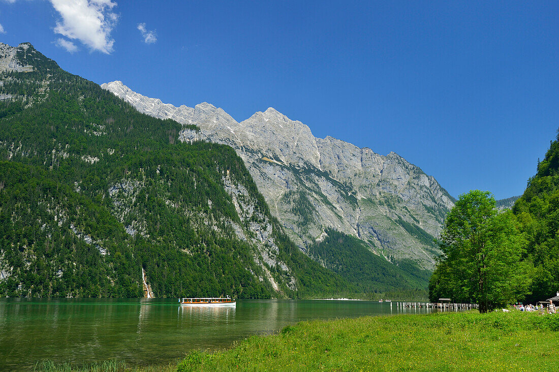 Boat crossing lake Koenigssee, Watzmann and Watzmannkinder in background, Salet, lake Koenigssee, Berchtesgaden range, National Park Berchtesgaden, Berchtesgaden, Upper Bavaria, Bavaria, Germany