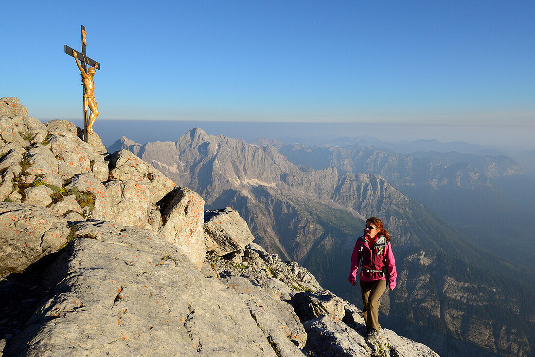 Woman ascending to Hocheck, Hochkalter in background, Watzmann, Berchtesgaden Alps, Berchtesgaden National Park, Berchtesgaden, Upper Bavaria, Bavaria, Germany