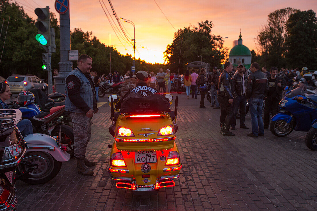 Motorcyclists congregating at Sparrow Hills at sunset, Moscow, Russia, Europe