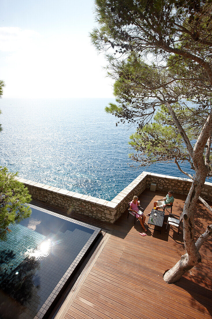 Guests on deck near the Cliff Pool, Aman Sveti Stefan, Sveti Stefan, Budva, Montenegro