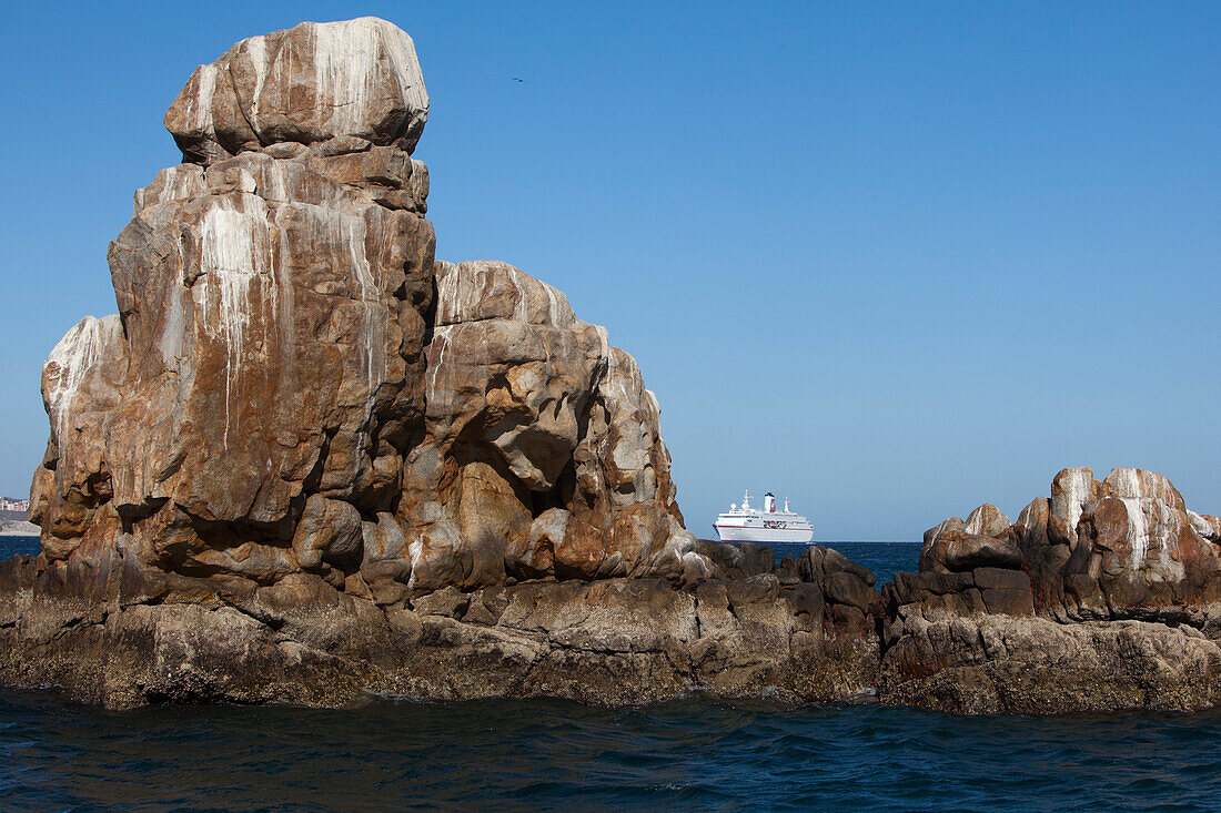 Cruise ship MS Deutschland (Reederei Peter Deilmann) and rock formation near Land's End, Cabo San Lucas, Baja California Sur, Mexico