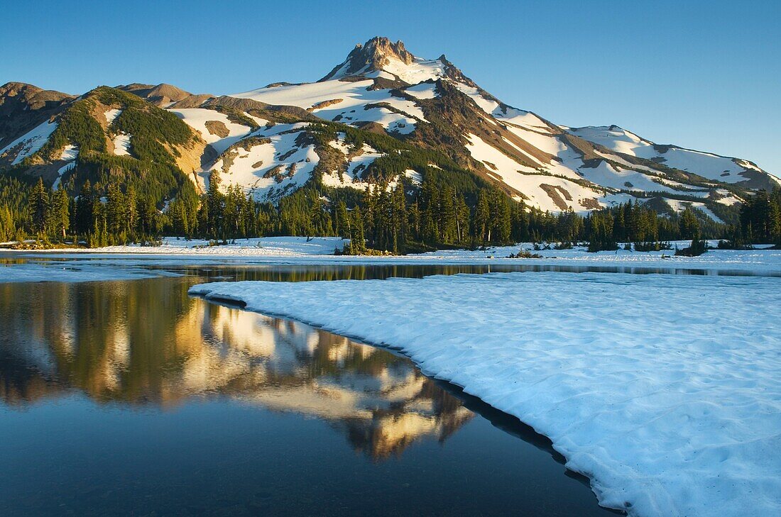 Mount Jefferson seen from ice covered Russell Lake in Jefferson Park, Mount Jefferson Wilderness, Oregon