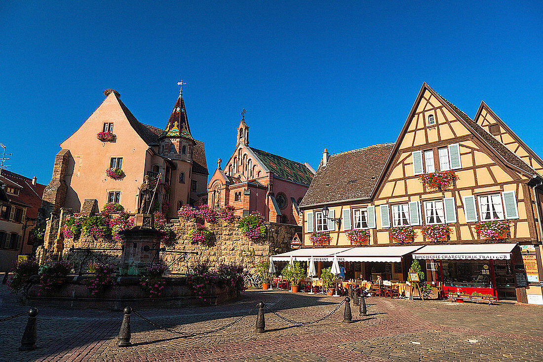 Market square and picturesque houses in Eguisheim, Alsace, France, Europe