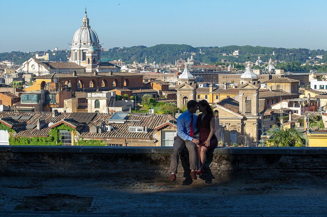 Couple kissing in the city of Rome Italy