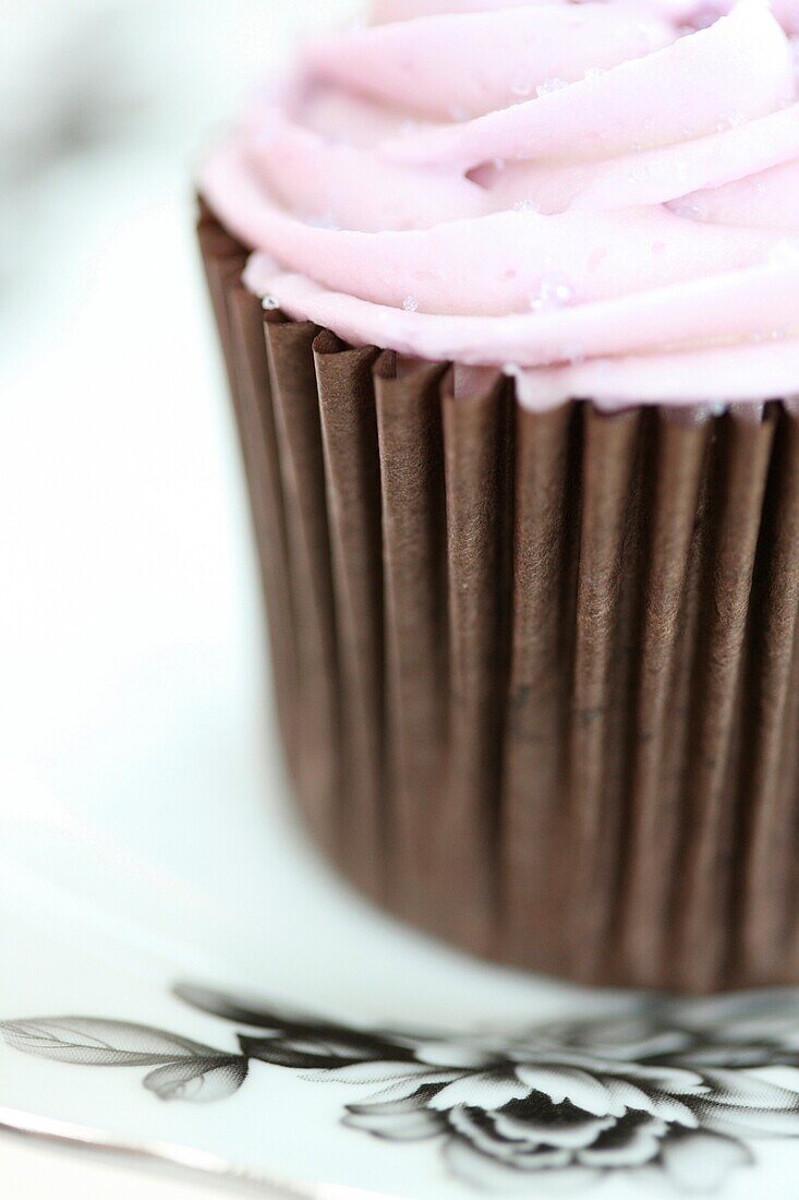 a truly gorgeous cup cake with pink swirl icing