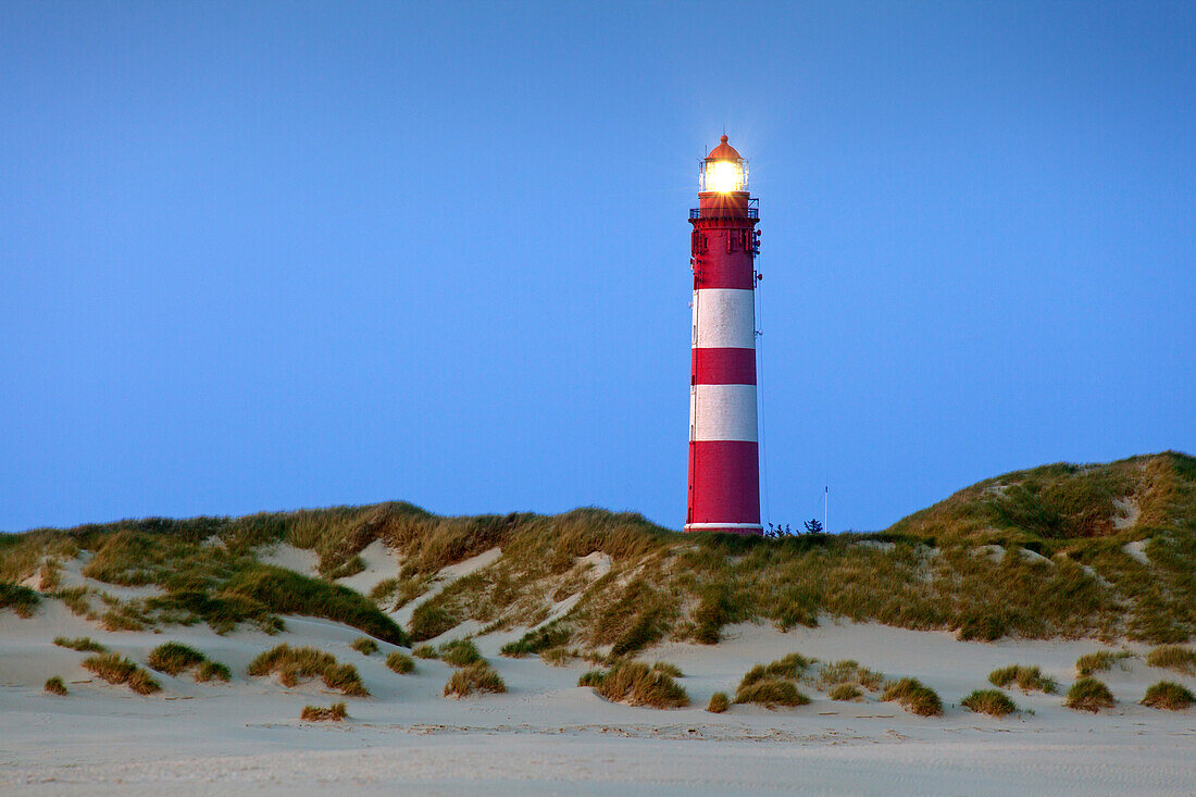 Lighthouse in the dunes at the beach, Kniepsand, Amrum island, North Sea, North Friesland, Schleswig-Holstein, Germany