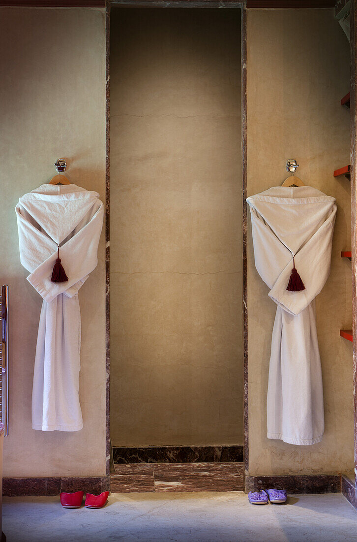 Two bathrobes hanging in the shower area of room 16, El Fenn, Marrakech, Morocco