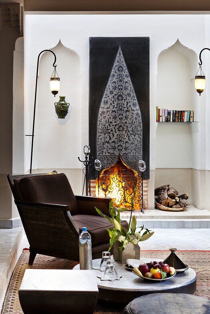 Fireplace in guest room 5, Riad Farnatchi, Marrakech, Morocco