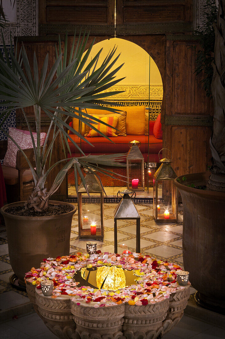 Courtyard fountain with seating area, Riad Enija, Marrakech, Morocco