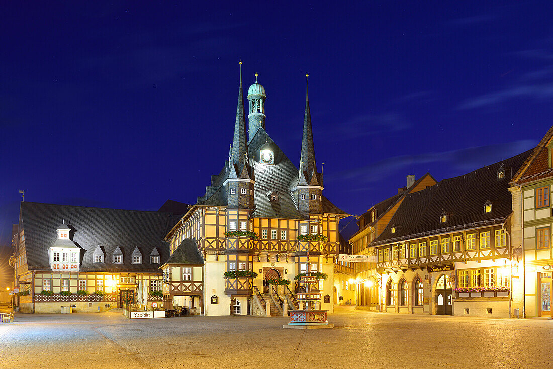 View over market square to illuminated town hall, Wernigerode, Saxony-Anhalt, Germany