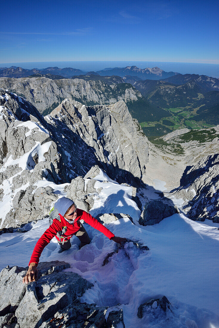 Woman ascending to Hochkalter, Berchtesgaden National Park, Berchtesgaden Alps, Upper Bavaria, Bavaria, Germany